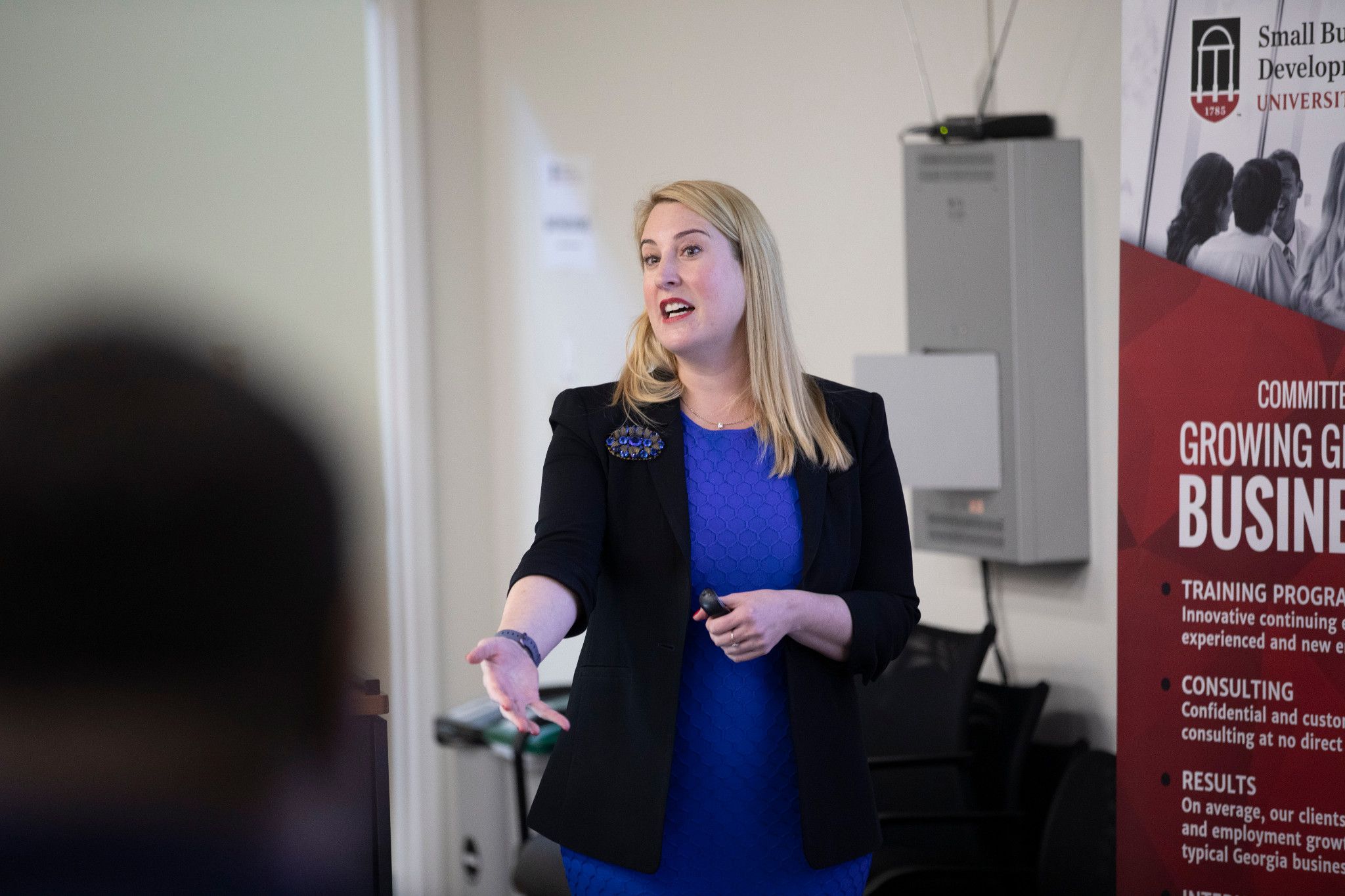 A women speaking in a lecture setting