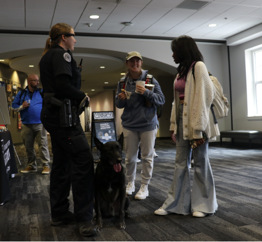 Two students talking to a police officer