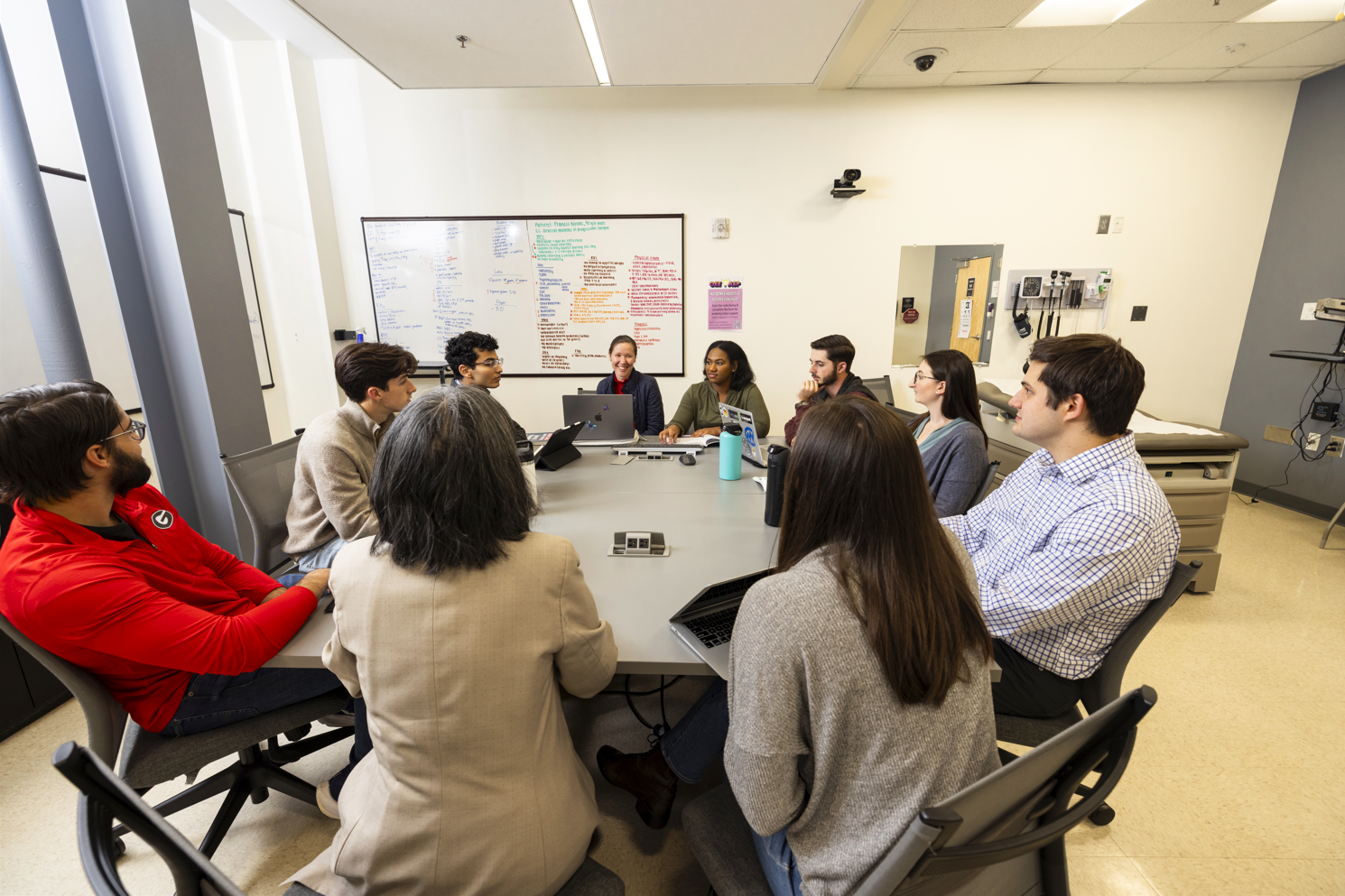 People gathered around a table at the innovation boot camp