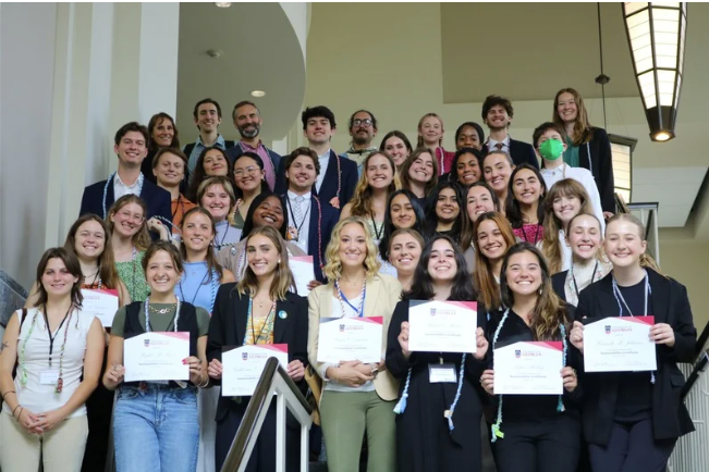 sustcertcohort Students gathered with their sustainability certificates on display